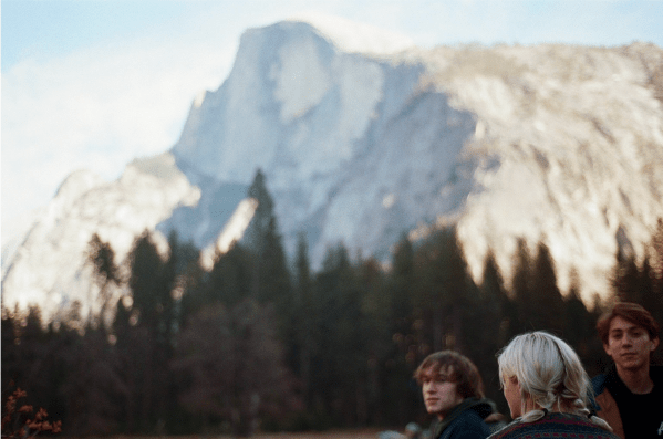 A group of Stanford students admire Yosemite's Half Dome.