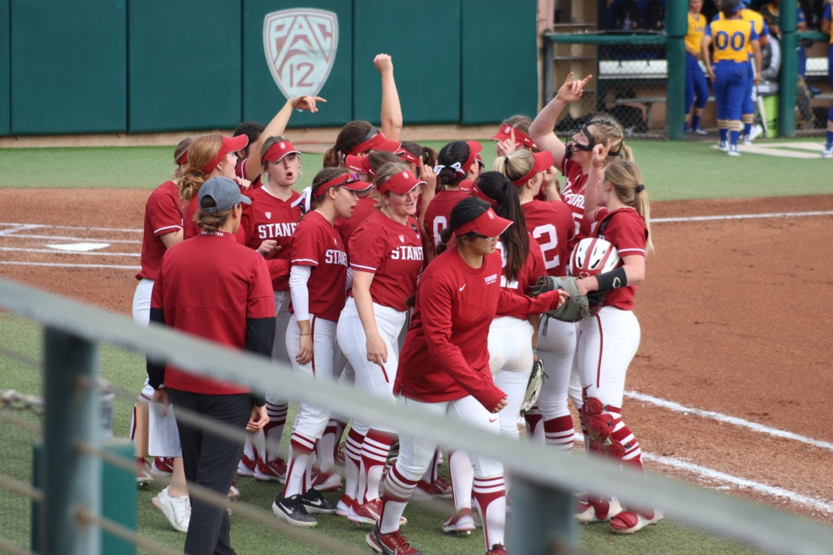 The Stanford team huddles up to celebrate the win.