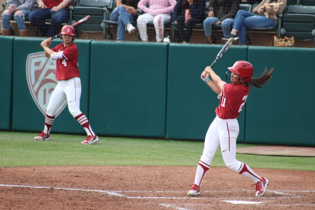 Kaitlyn Lim swings the bat at a pitch.