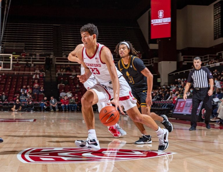 Sophomore forward Brandon Angel dribbles the ball into the defense.