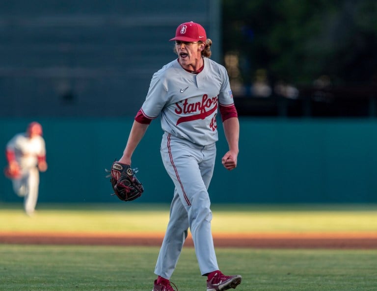 Sophomore left-handed pitcher Drew Dowd celebrates after an out.