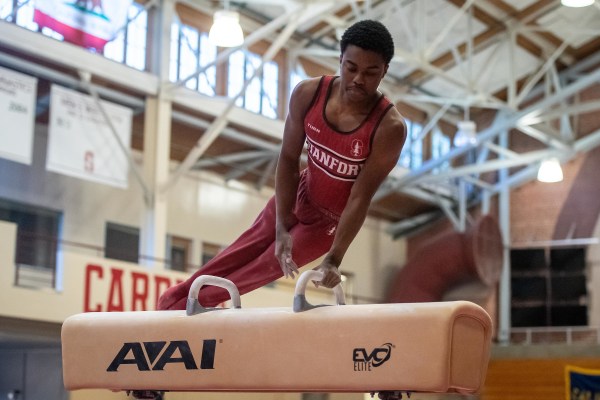 Freshman Khoi Young competing on the pommel horse