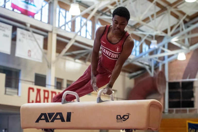 Freshman Khoi Young competing on the pommel horse