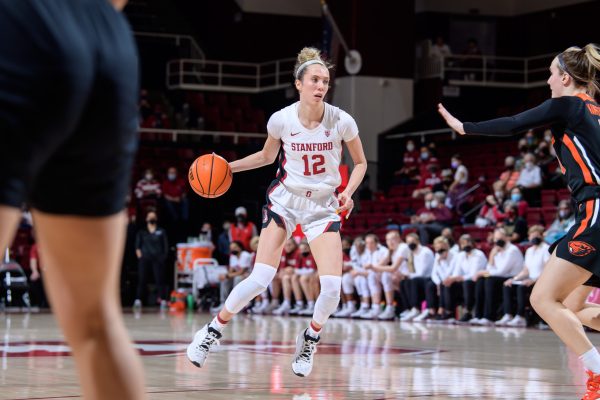 Senior guard Lexie Hull dribbles the basketball up the floor.