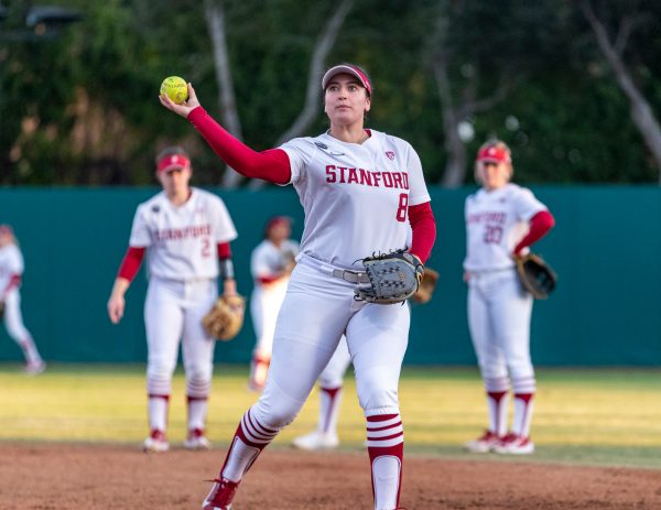 Senior pitcher Molly Millar throws the softball from the mound.