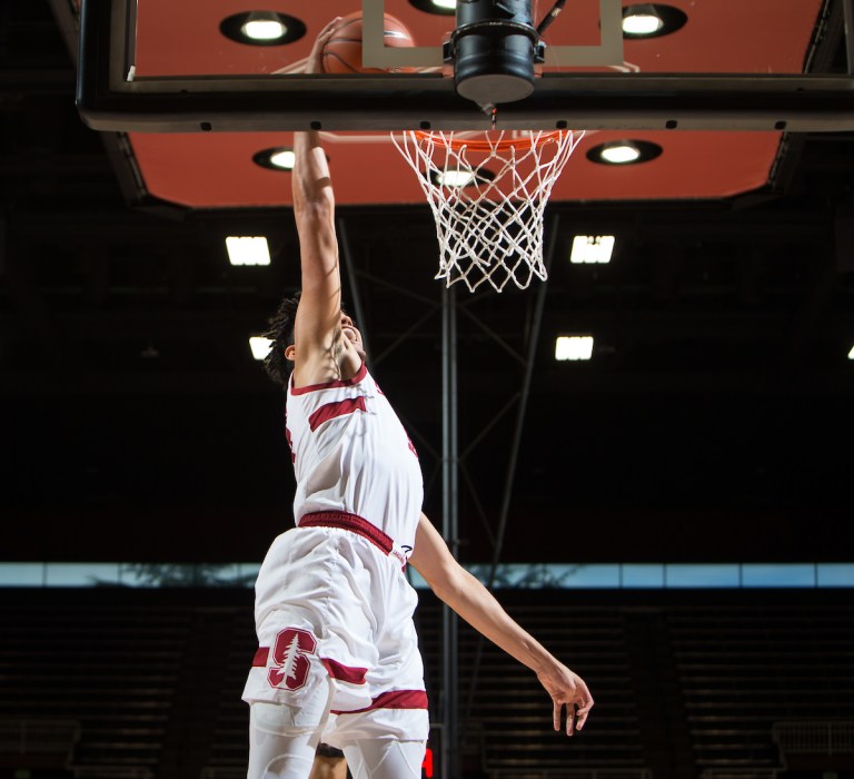 Junior forward Spencer Jones rises for an open dunk.