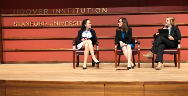 Geisha Williams, former CEO of PG&E, sits in-between two panelists at the 6th Annual Schneider Memorial Lecture