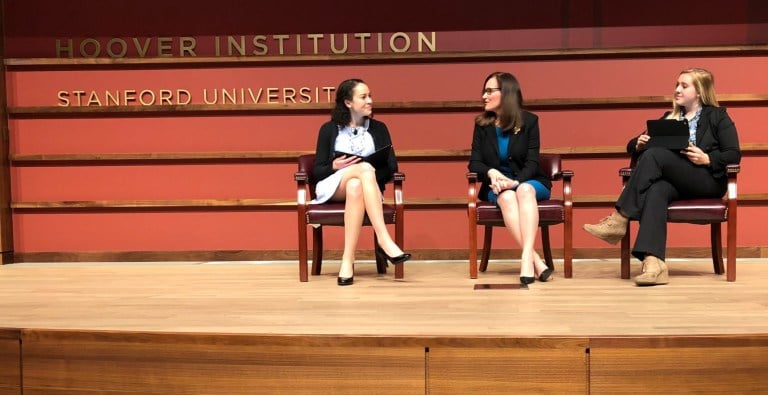 Geisha Williams, former CEO of PG&E, sits in-between two panelists at the 6th Annual Schneider Memorial Lecture