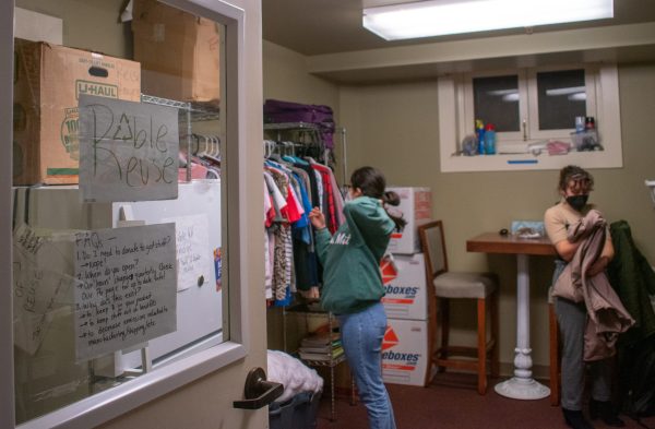 Two students browse the Roble Reuse store.