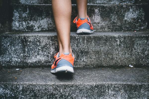 A runner walking up a flight of stairs