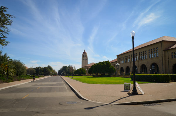 Entrance of campus on Jane Stanford way, featuring Hoover Tower and part of Main Quad.