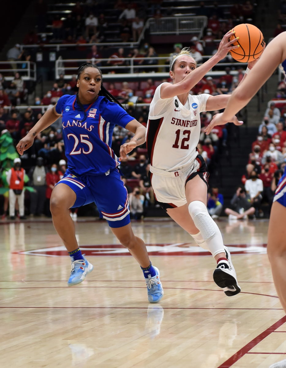 Lexie Hull catches a pass and drives to the basket.