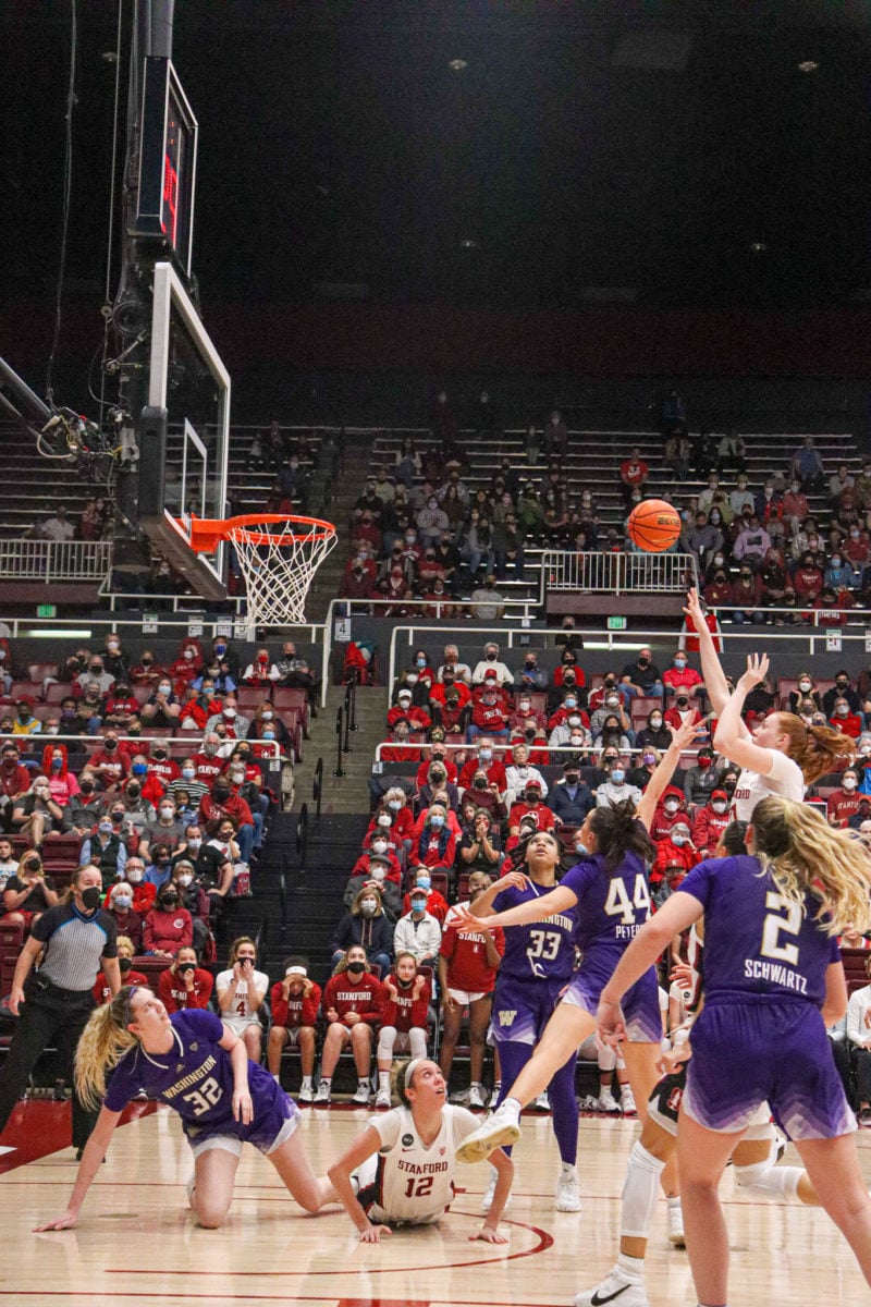 Ashten Prechtel takes a jump shot as several players attempt to defend her.