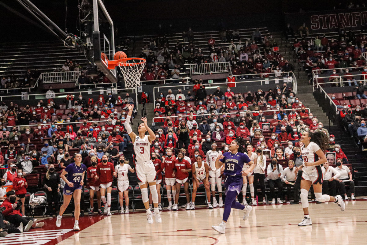 Anna Wilson makes a layup with several players in the background.