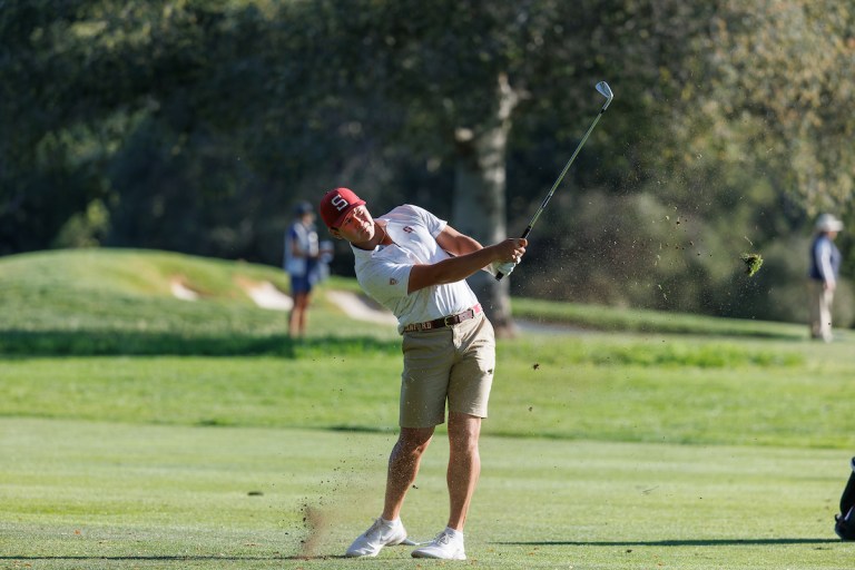 Sophomore Karl Vilips hits an approach shot.