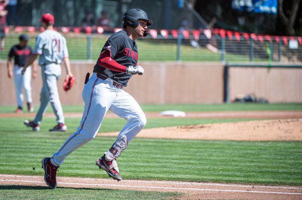 Brett Barrera rounds the bases after a hit.