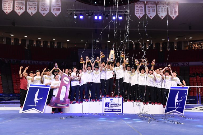 Stanford men's gymnastics celebrates its NCAA Championship atop the podium.