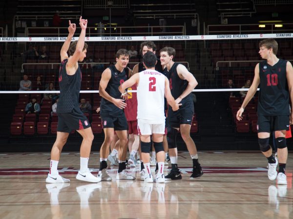 Will Rottman celebrates with his teammates after scoring a point against GCU.