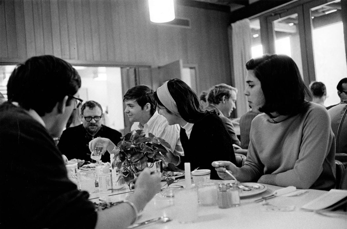 Five students eating at a table.