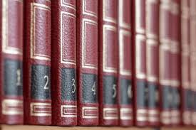 Close-up view of a set of numbered red books, spines facing out like on a bookshelf