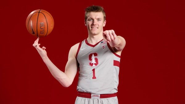 Graduate student guard Michael Jones poses with a basketball