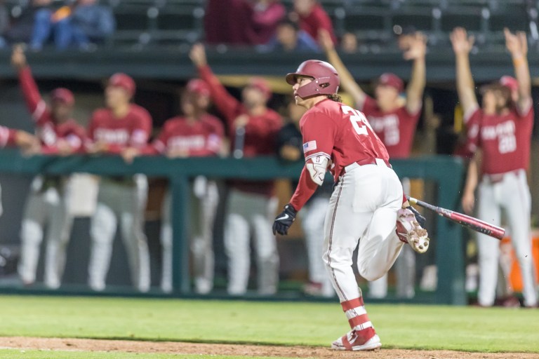 Trevor Haskins drops his bat to run after a hit.