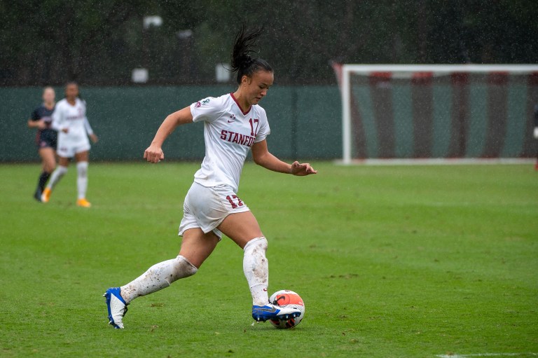 Amy Sayer dribbles the soccer ball.