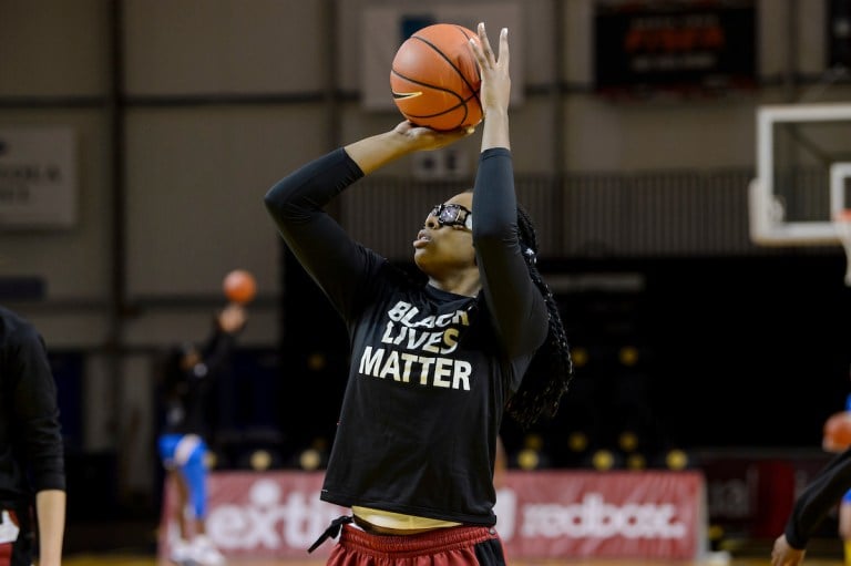 Rising senior forward Fran Belibi (above) warms up for a game against UCLA on Jan. 31, 2021. (Photo: KAREN HICKEY/isiphotos.com)