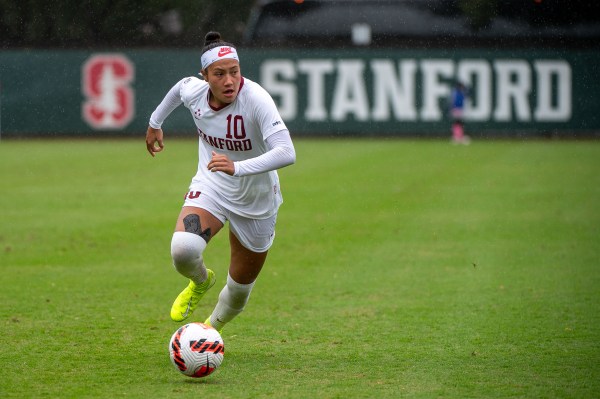 Maya Doms dribbles the soccer ball