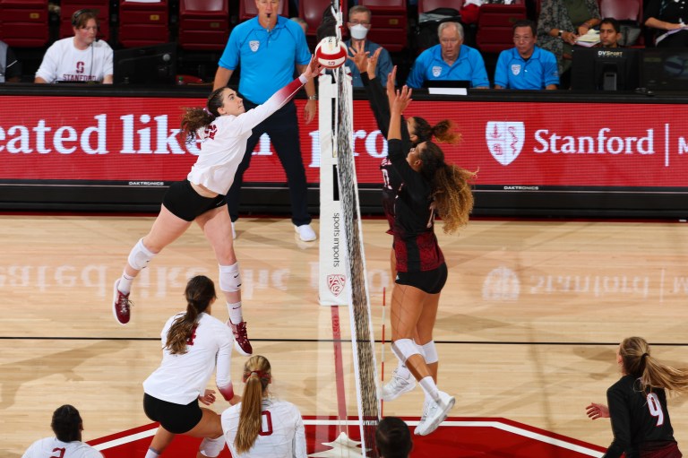 Caitie Baird tries to attack at the net.