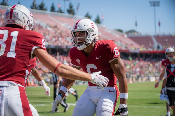 Receivers Elijah Higgins and Brycen Tremayne celebrate against Oregon last season