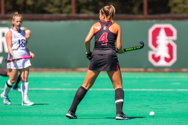 A girl waits for the ball to come to her.