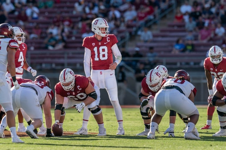 Tanner McKee lines up on the field behind his offensive line