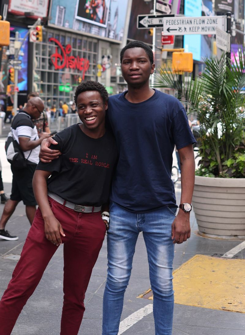 Mpala and Nyandoro in New York City, Disney store in the background