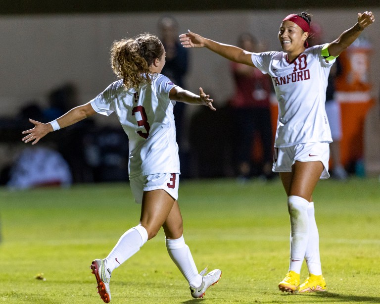 Freshman forward Allie Montoya and senior midfielder Maya Doms celebrate after a goal earlier in the season. Montoya scored both of Stanford's goals against Washington. (Photo: JOHN LOZANO/isiphotos.com)