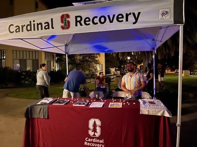 A photo of the Cardinal Recovery group at a tent on The Row