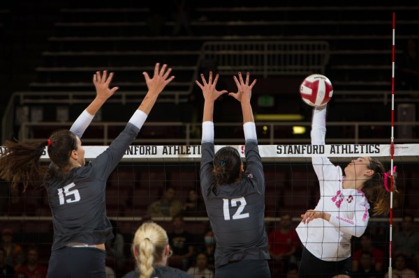 Elia Rubin swings at the ball during a volleyball game.