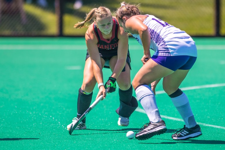 Lynn Vanderstichele attacks during a field hockey game.