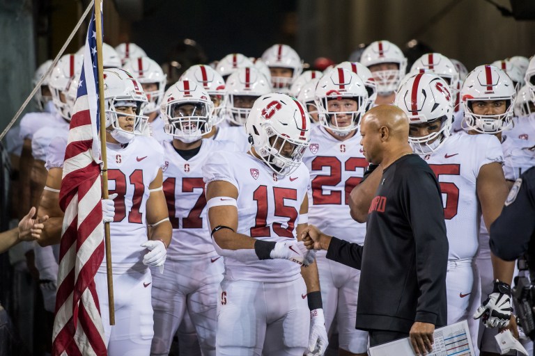 The football team gathers together in the tunnel before running out to the field