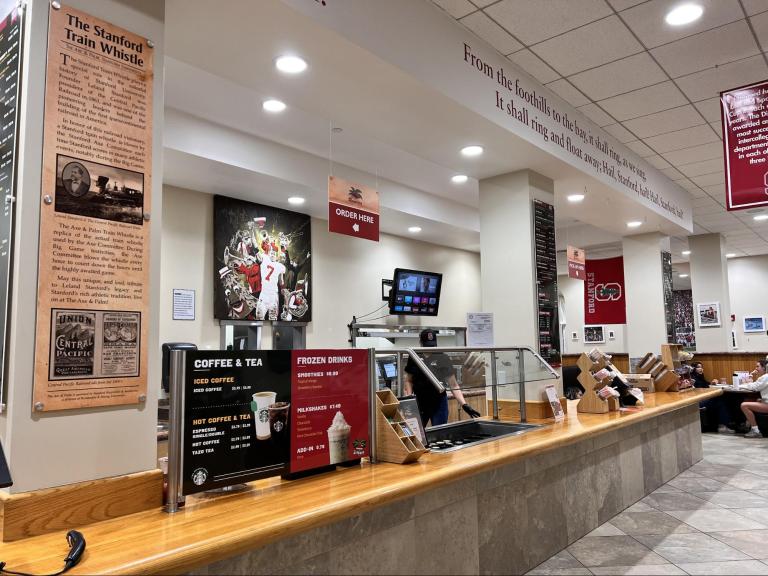 An image of the cashier of The Axe & Palm under the "Order Here" sign.