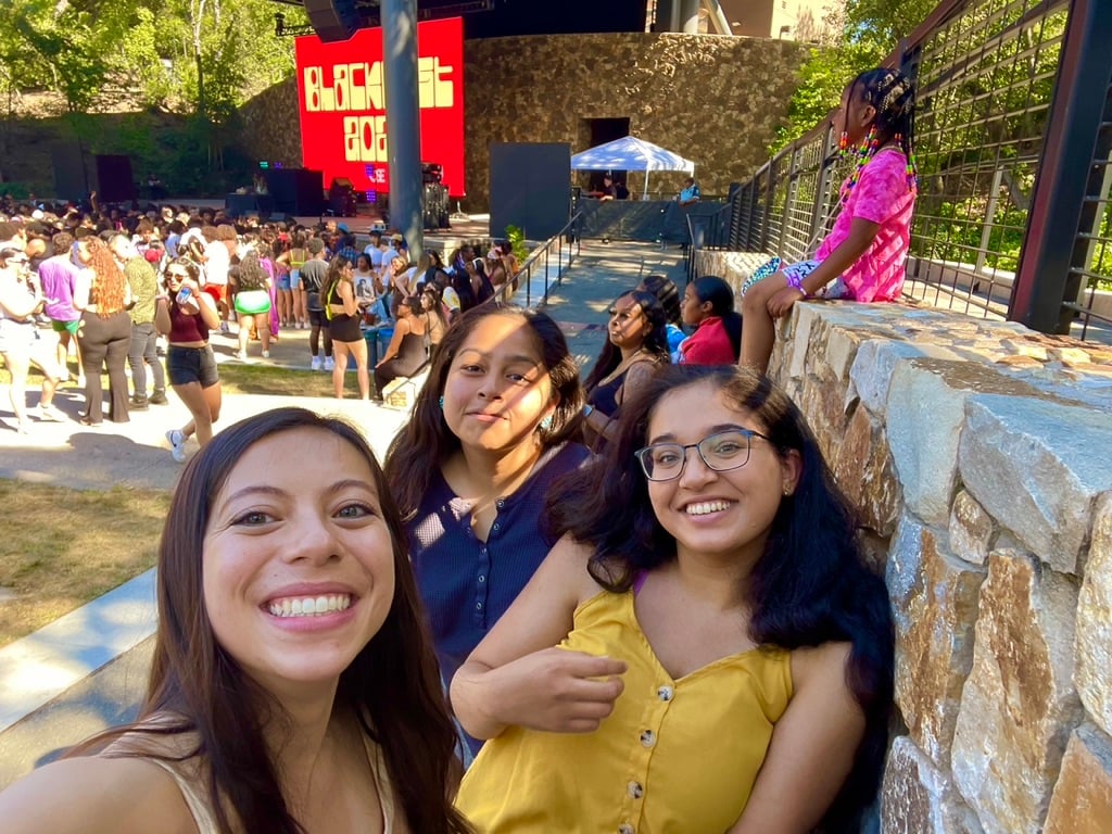 Three people take a selfie at Frost Ampitheater's Blackfest.