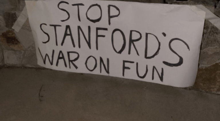 white poster reads stop stanford's war on fun pasted in white plaza