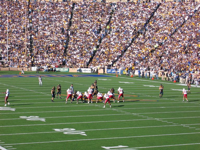 Stanford football playing against Berkeley football game with a packed crowd in a stadium