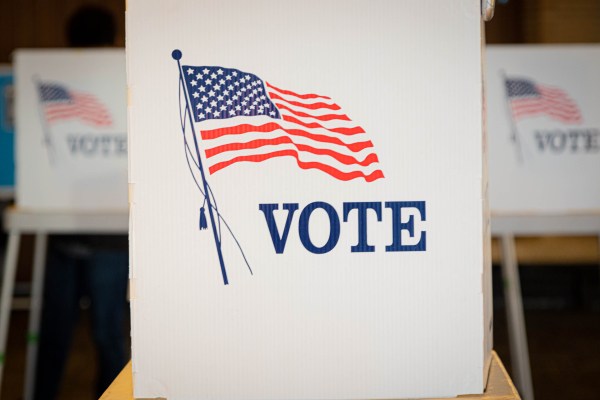 Cubicle with american flag and the words vote