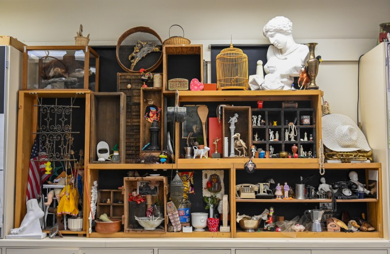 Items on shelves in an arts classroom.