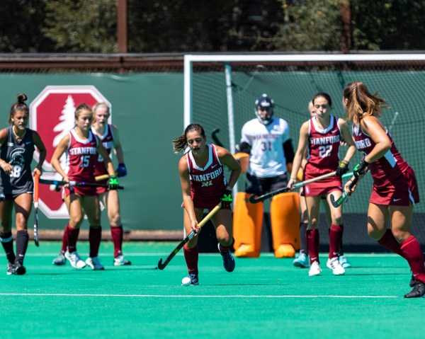 Caroline Guden runs during a field hockey game.