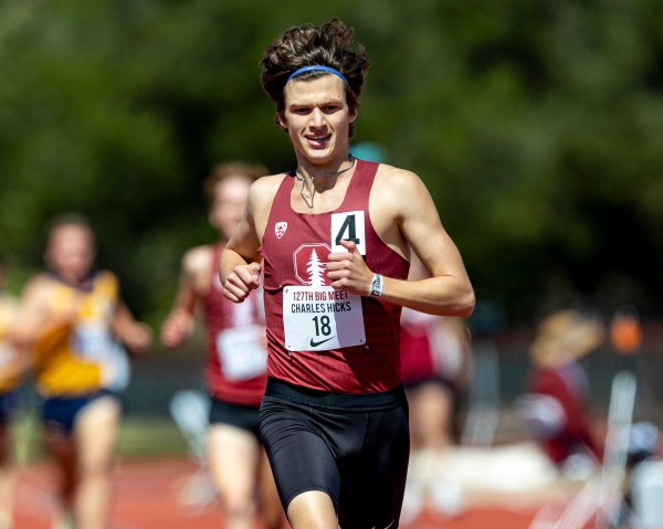 A runner in a red jersey runs