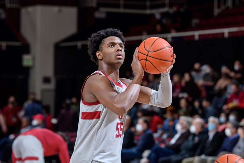 A basketball player shoots a basketball