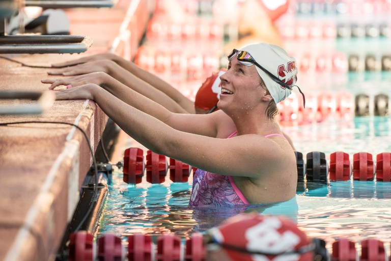 Sam Tadder hangs onto the edge of the pool and smiles