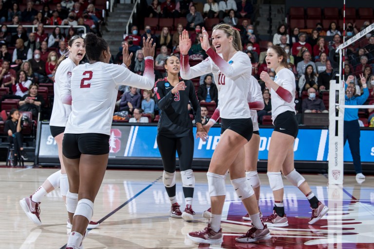 Players celebrate after winning a point.